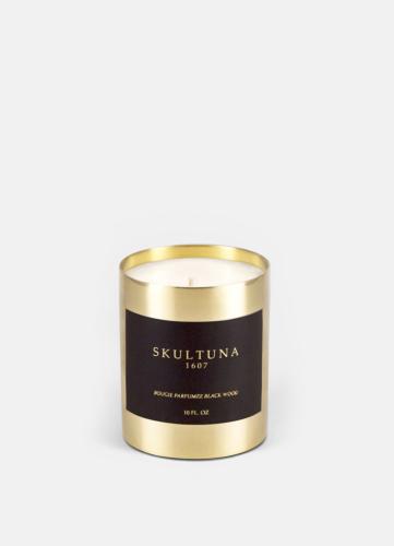 Skultuna Blackwood luxury scented candle in brass vessel on white background